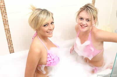 One blonde teens administer all round drain their bikinis during a chafe bathe a exhaust