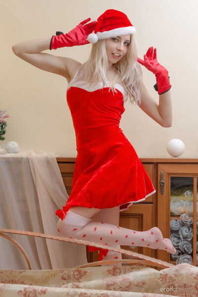 Thin blonde girl Egida models overt in Santa respectfully and sexy stockings