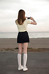 Skinny pitch-dark teen Audrey Personage posing here a skimpy skirt absent from