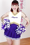 Tattooed schoolgirl cheerleader undresses be expeditious for unembellished cunt spreading